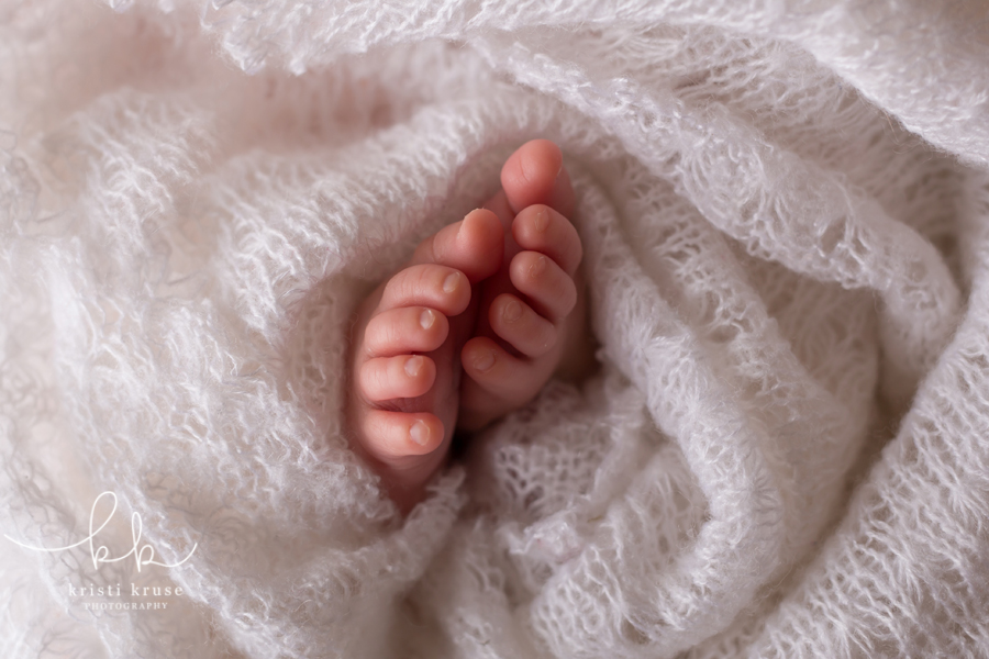 Close up shot of newborn baby toes