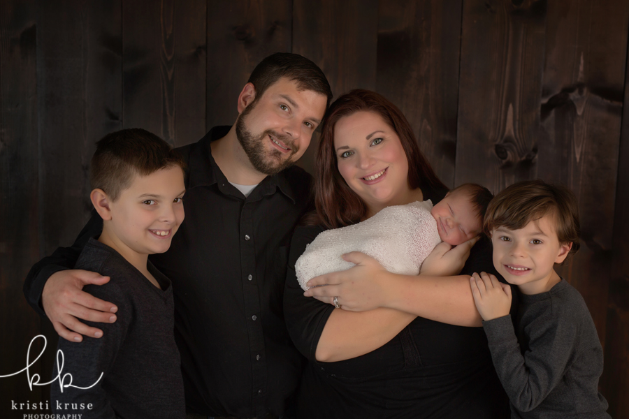 Family photo with Dad, Mom, 2 brothers and newborn baby sister