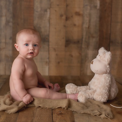 6 month old baby with teddy beat photo