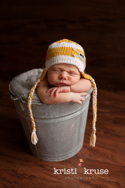Newborn in a bucket shot